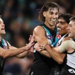 Brynn Teakle celebrates with teamates against Richmond