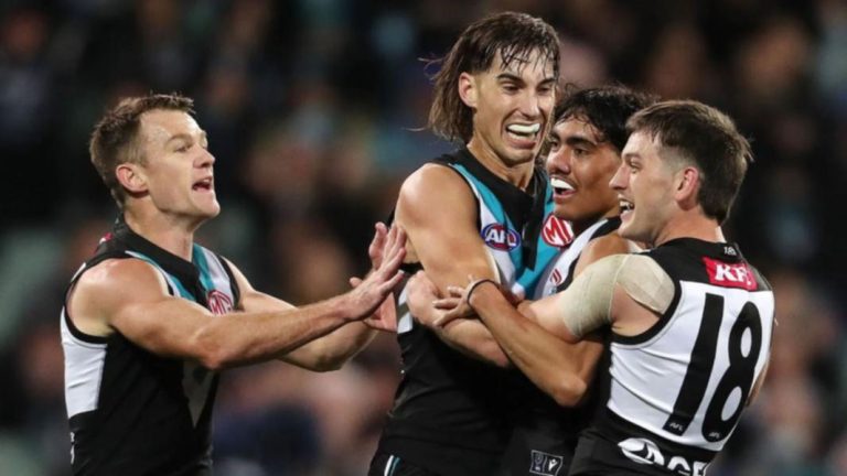 Brynn Teakle celebrates with teamates against Richmond